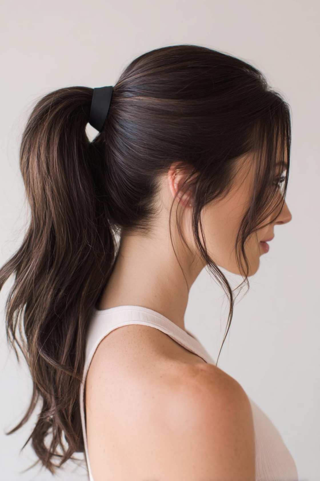 15+ Ace Tennis Hairstyles: Secure Braids, Ponytails & Buns for the Court. - 21. High Ponytail with a Wrap