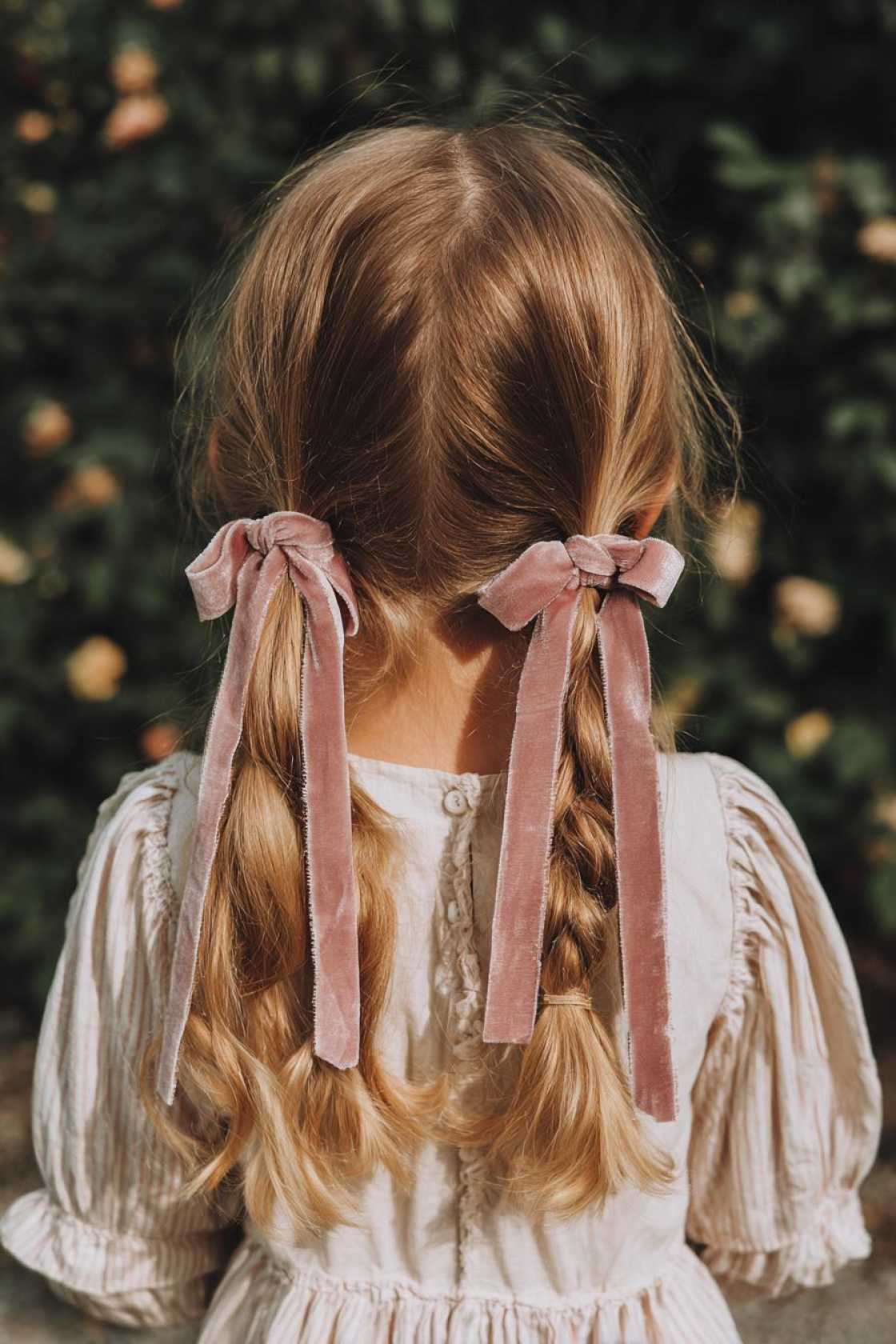 15+ Adorable Doll Hairstyles to Channel Your Inner Cutie (Curls, Bows & More!). - 15. Pigtails with Ribbon Ties
