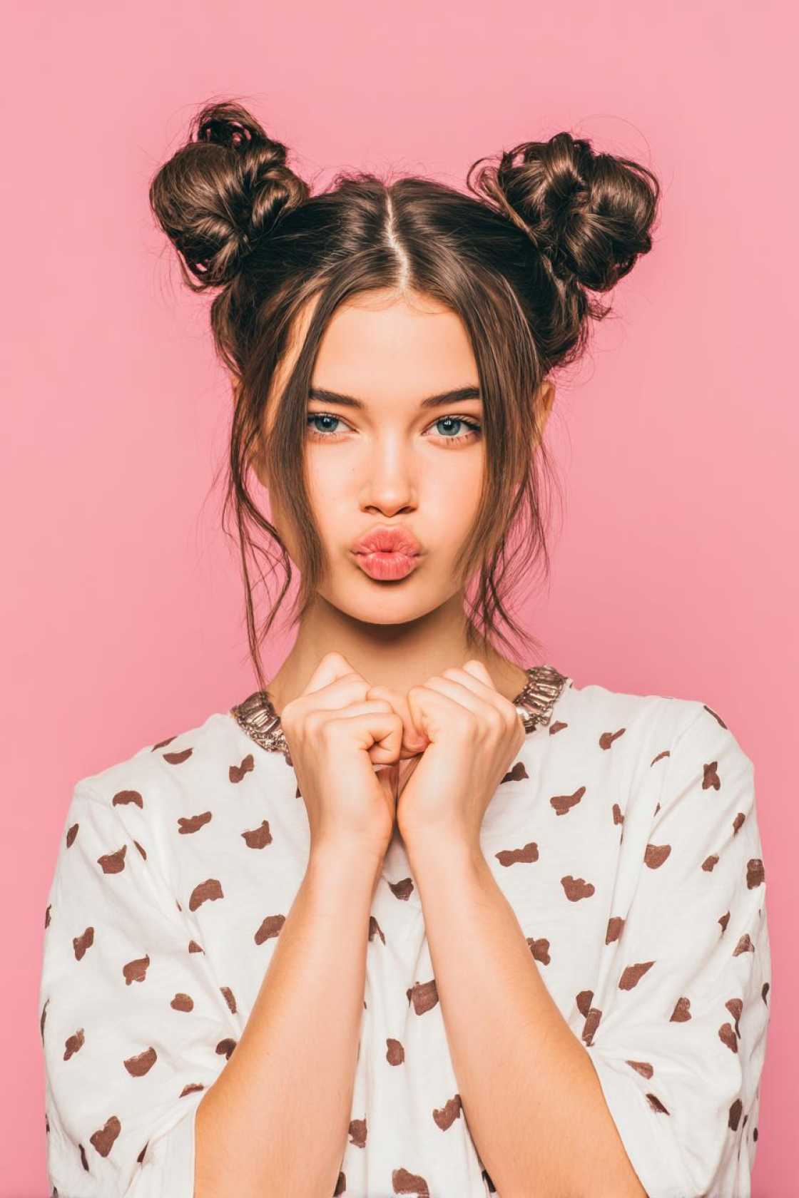 15+ Adorable Doll Hairstyles to Channel Your Inner Cutie (Curls, Bows & More!). - 14. Low Space Buns