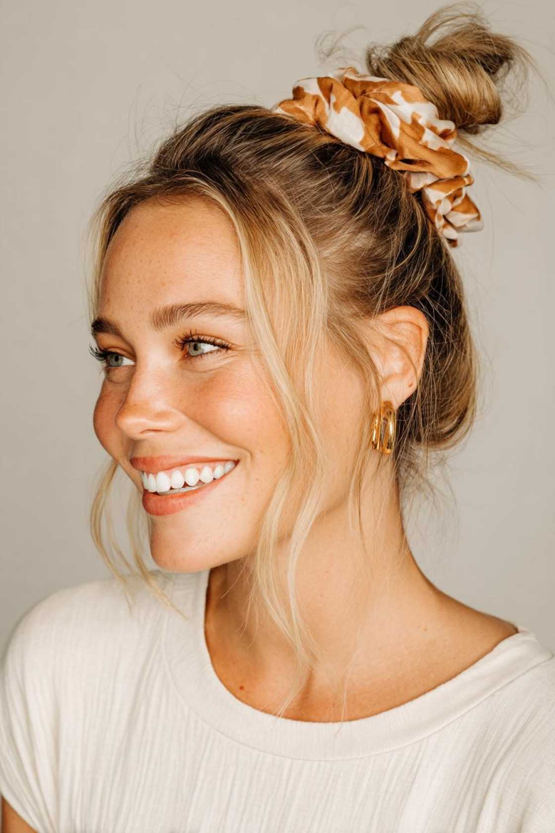 15+ Chic & Comfy Airport Hairstyles for Your Next Trip (Travel in Style!) - 2. The Low Ponytail with a Twist