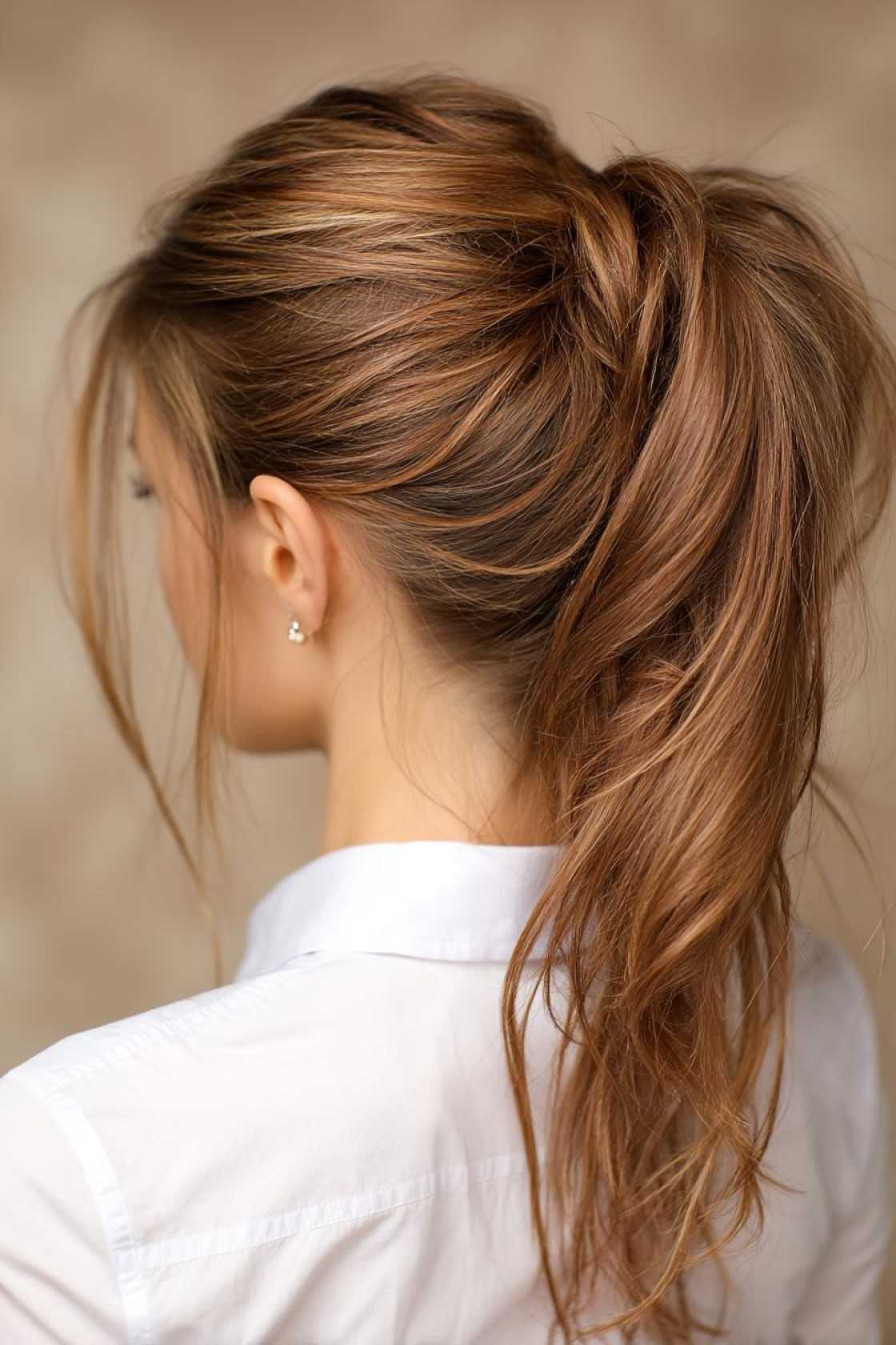 15+ Chic & Easy Hairstyles for the Beach (Waves, Braids, & Updos!). - 13. High Ponytail with a Twist