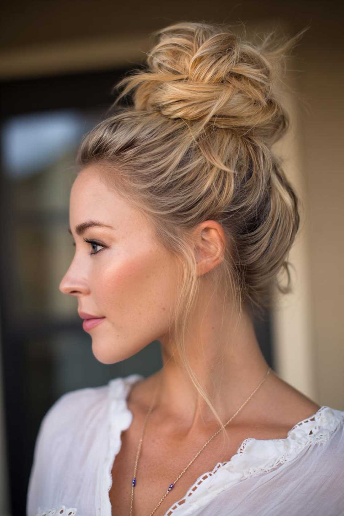 15+ Effortless Beach Hairstyles: Salty Waves, Chic Braids & Easy Updos. - 3. High Messy Bun