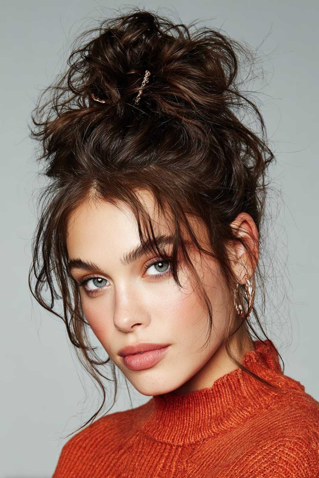 15+ Effortlessly Chic Messy Claw Clip Hairstyles You Can Do in Seconds! - 7. The Voluminous Top Knot Base