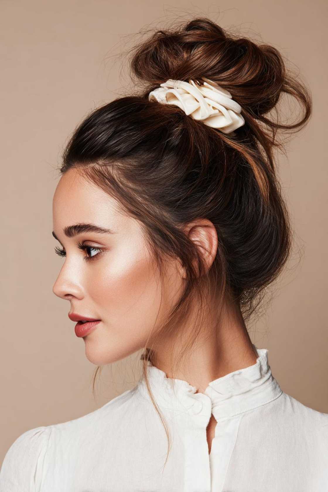 15+ Effortlessly Chic Messy Claw Clip Hairstyles You Can Do in Seconds! - 5. The Twisted High Bun