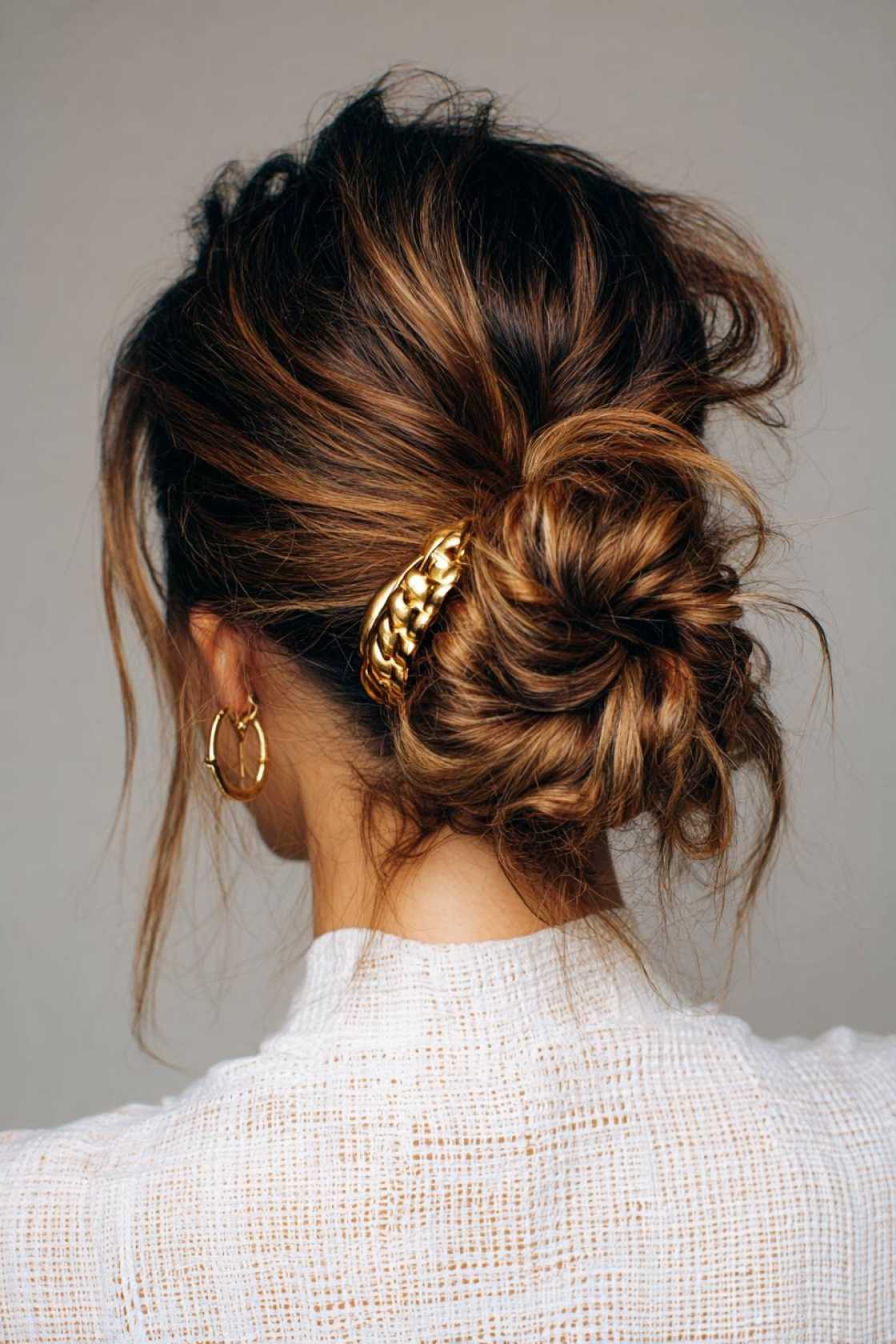 15+ Effortlessly Chic Messy Claw Clip Hairstyles You Can Do in Seconds! - 4. The Classic Messy Bun