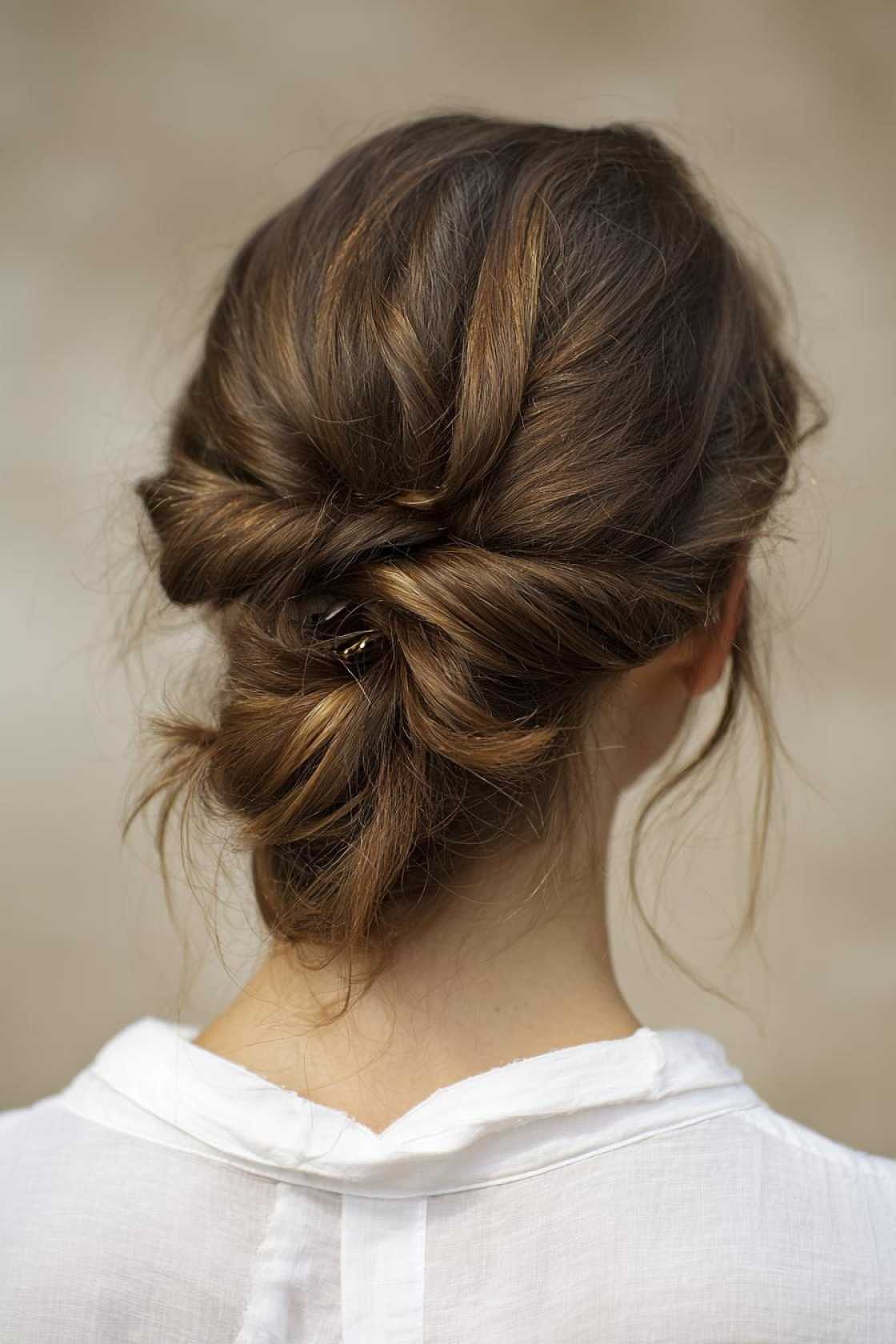 15+ Effortlessly Chic Messy Claw Clip Hairstyles You Can Do in Seconds! - 9. The Twisted Low Ponytail