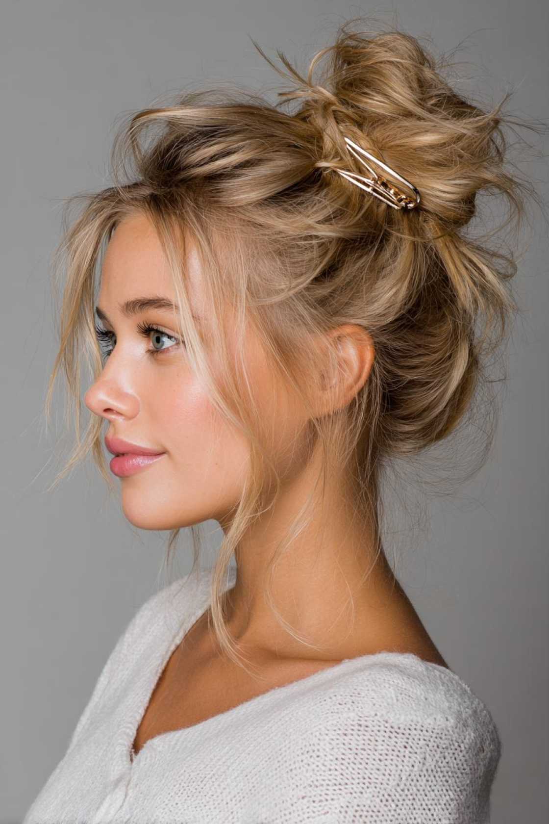 15+ Effortlessly Chic Messy Claw Clip Hairstyles You Can Do in Seconds! - 8. The Messy Bun Reinforcement