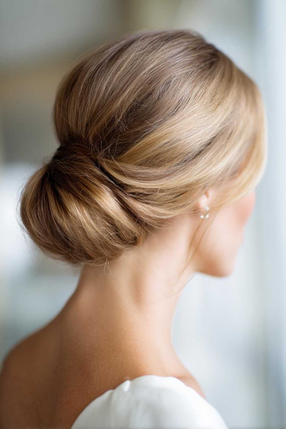 15+ Elegant Mother of the Groom Hairstyles for a Truly Special Day (All Hair Lengths). - 16. Classic Low Bun