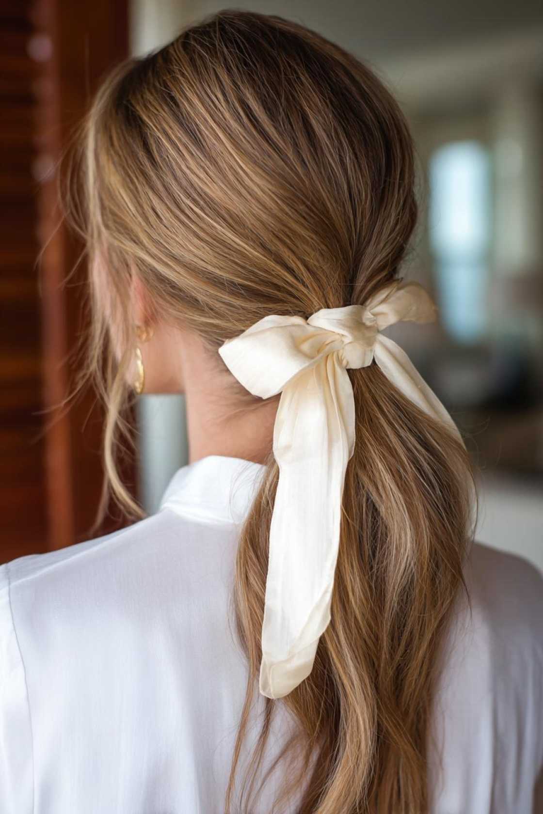 15+ Irresistible Date Night Hairstyles to Wow Them (Romantic, Chic & Easy!). - 3. Low Ponytail with Ribbon