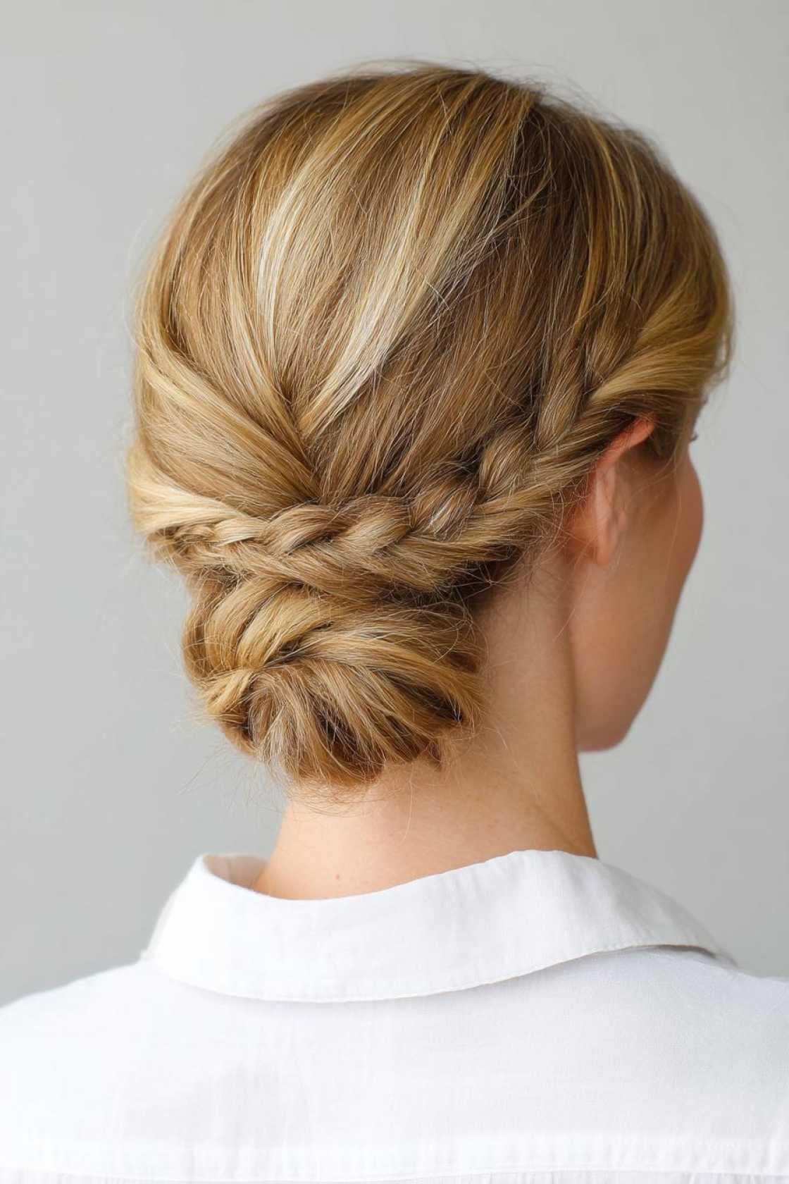 15+ Neat & Secure Waitress Hairstyles That Last Your Entire Shift (Food Service Approved!). - 6. Low Bun with Braid Detail