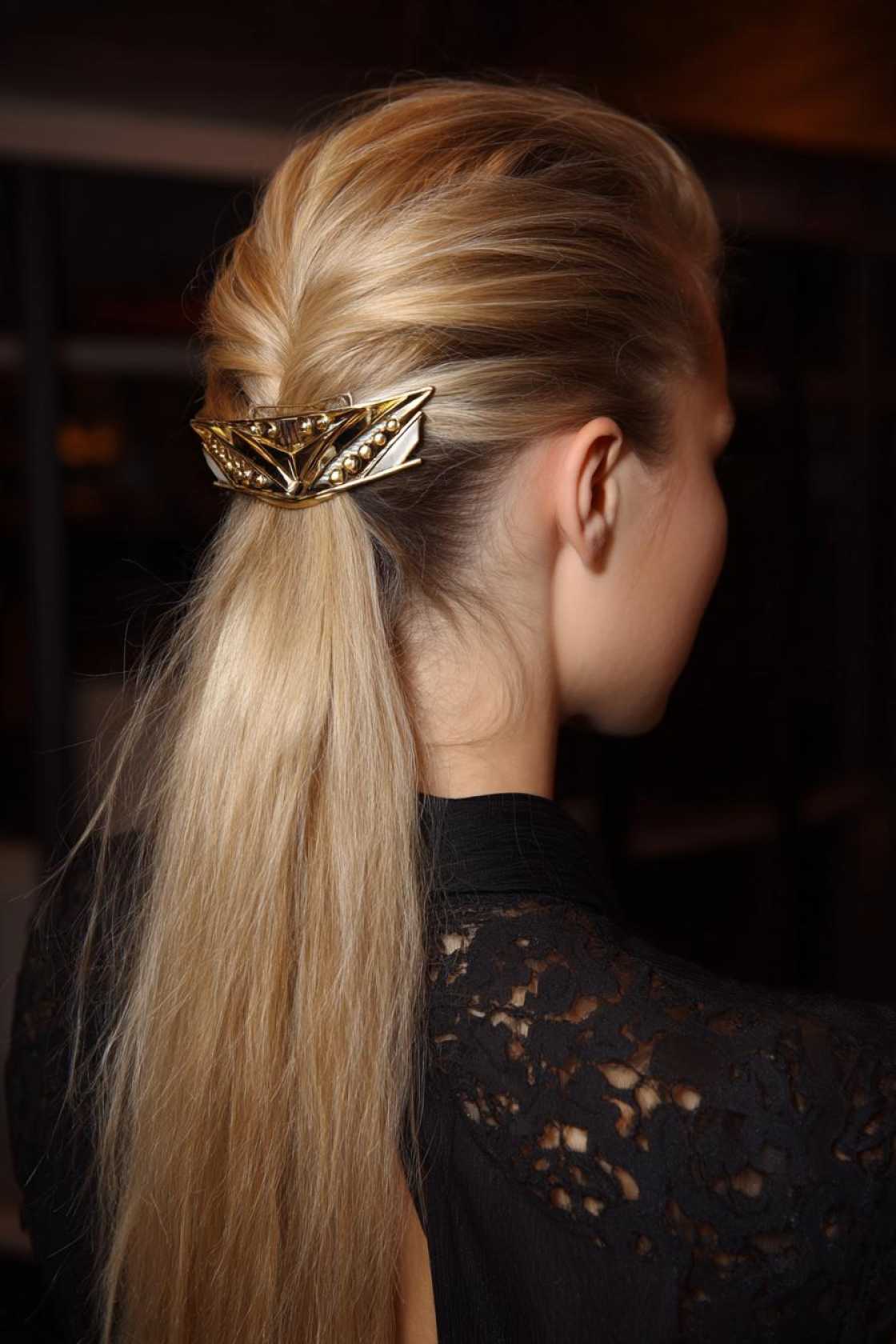 Accessorize Your Shoreline Style: 18+ Beach Hairstyles with Scarves, Hats & Clips - 8. Pulled-Back Hair with a Statement Cli