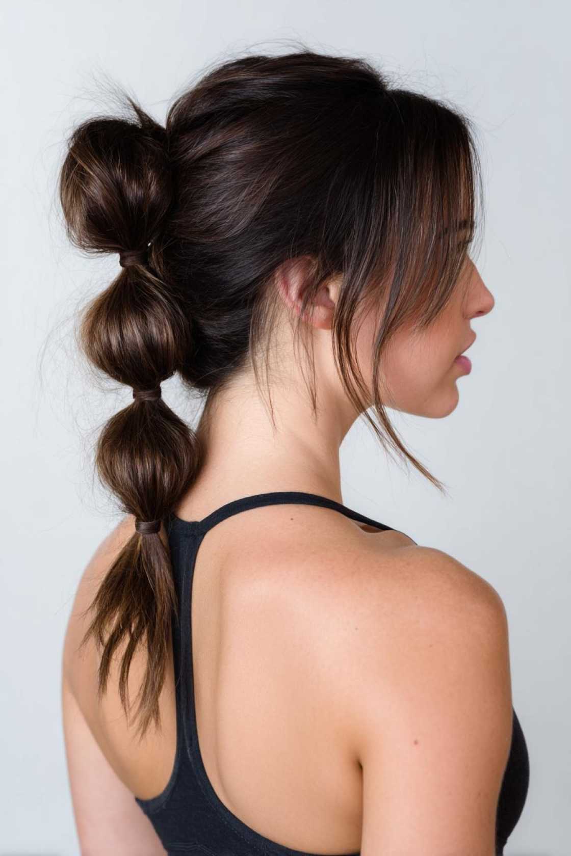 Beyond the Messy Bun: 20+ Creative & Secure Hairstyle Ideas for the Gym. - 4. Bubble Ponytail