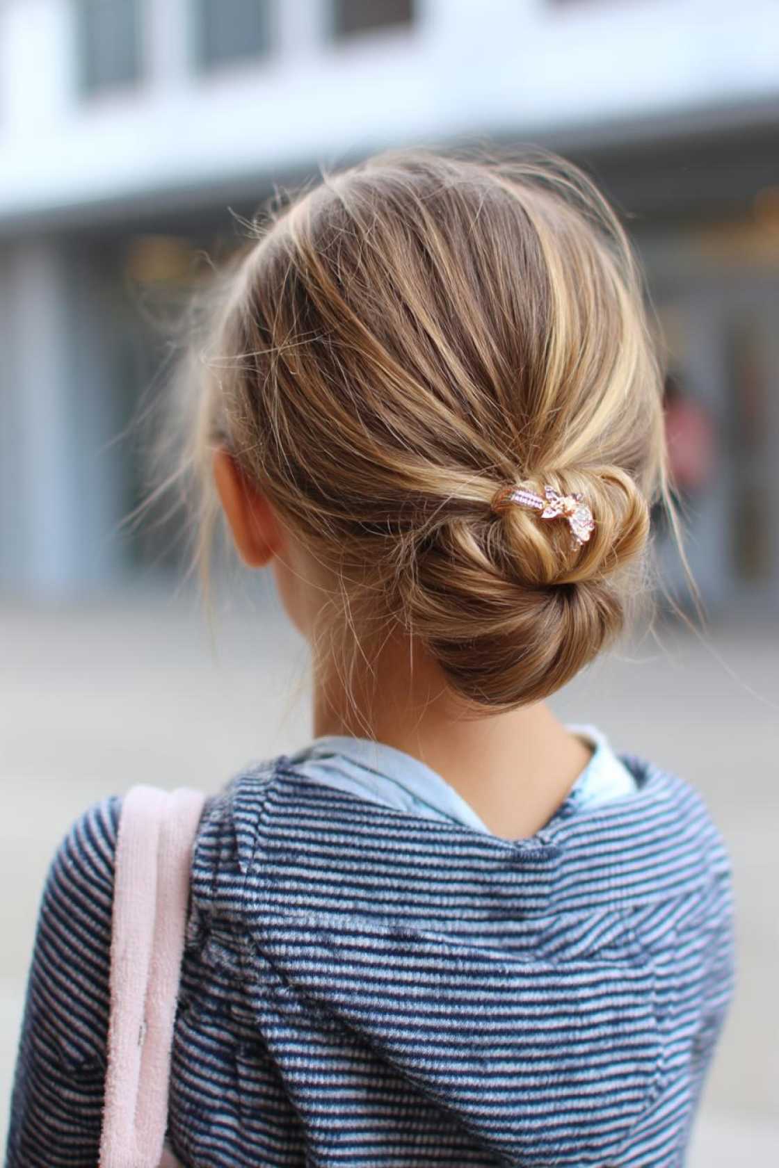 First Day Fresh: 20+ Cute & Quick Back to School Hairstyles Kids Will Love. - 21. Low Bun with Hair Clip