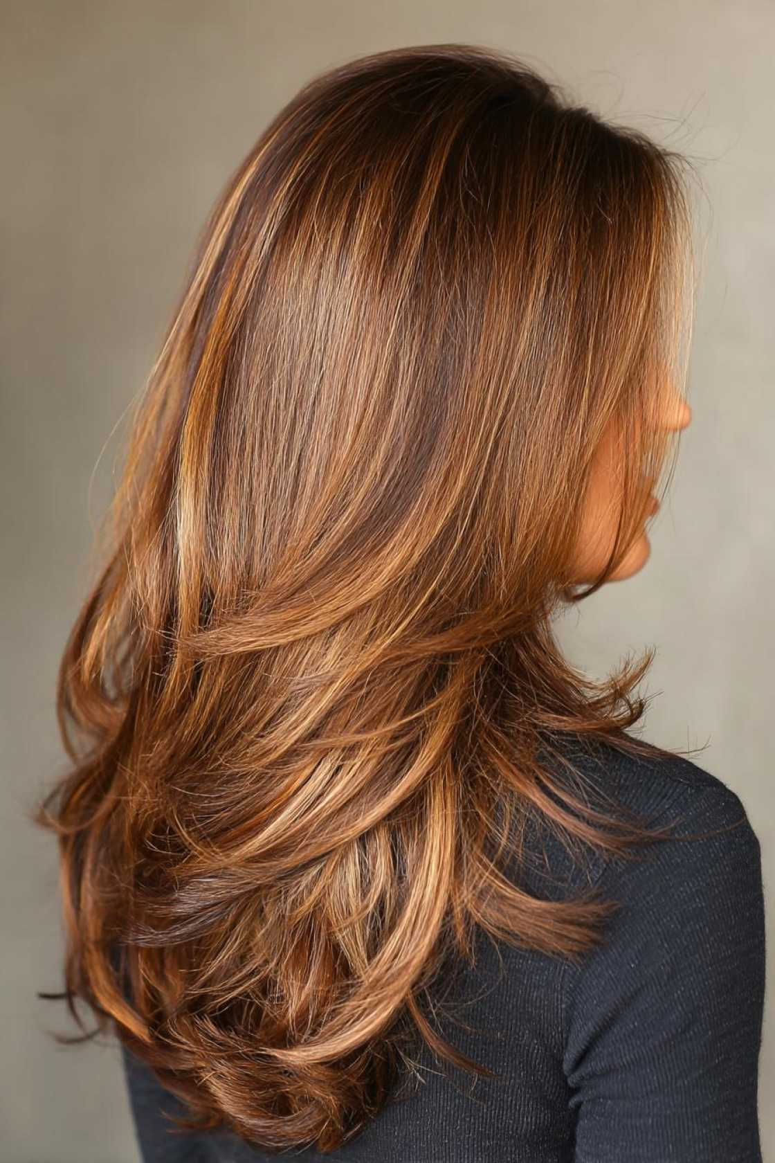 From Caramel Swirls to Ashy Tones: 20+ Trendsetting Hair Colors for Brunettes - 1. Warm-Toned Brunette with Highlights