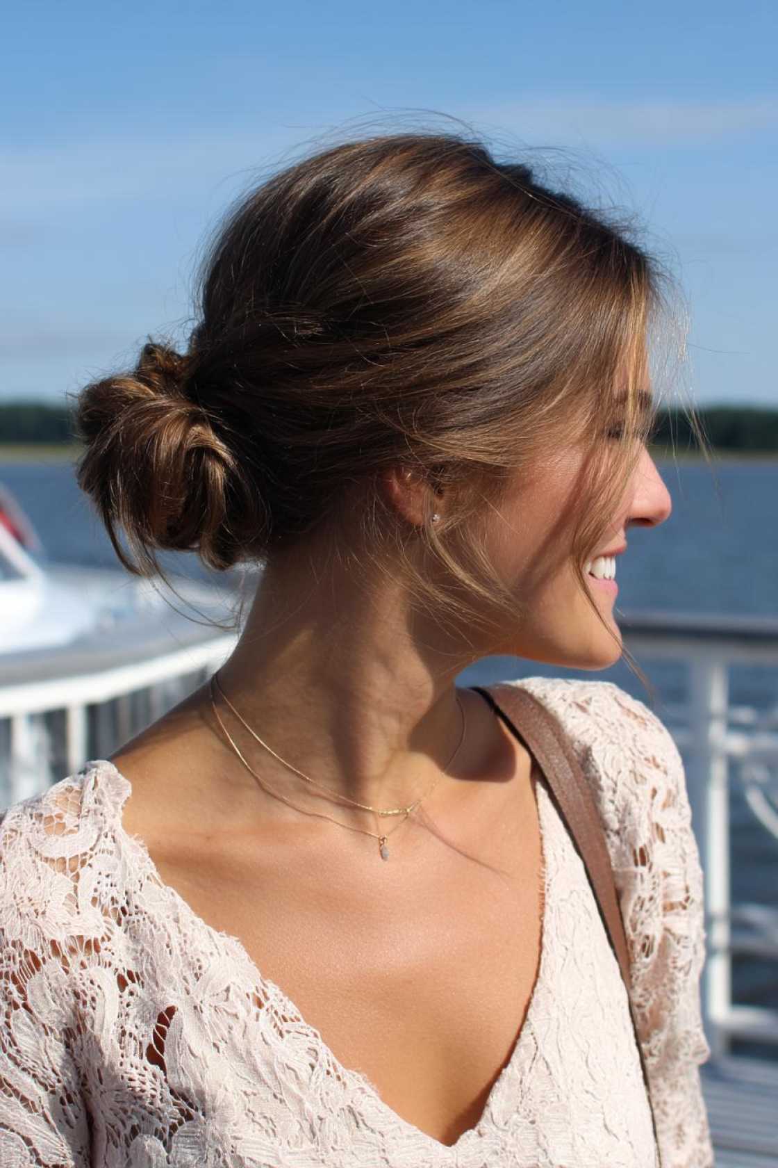 Lake Life Ready: 20+ Practical & Pretty Hairstyles You'll Love. - 13. Low Bun with Side Part