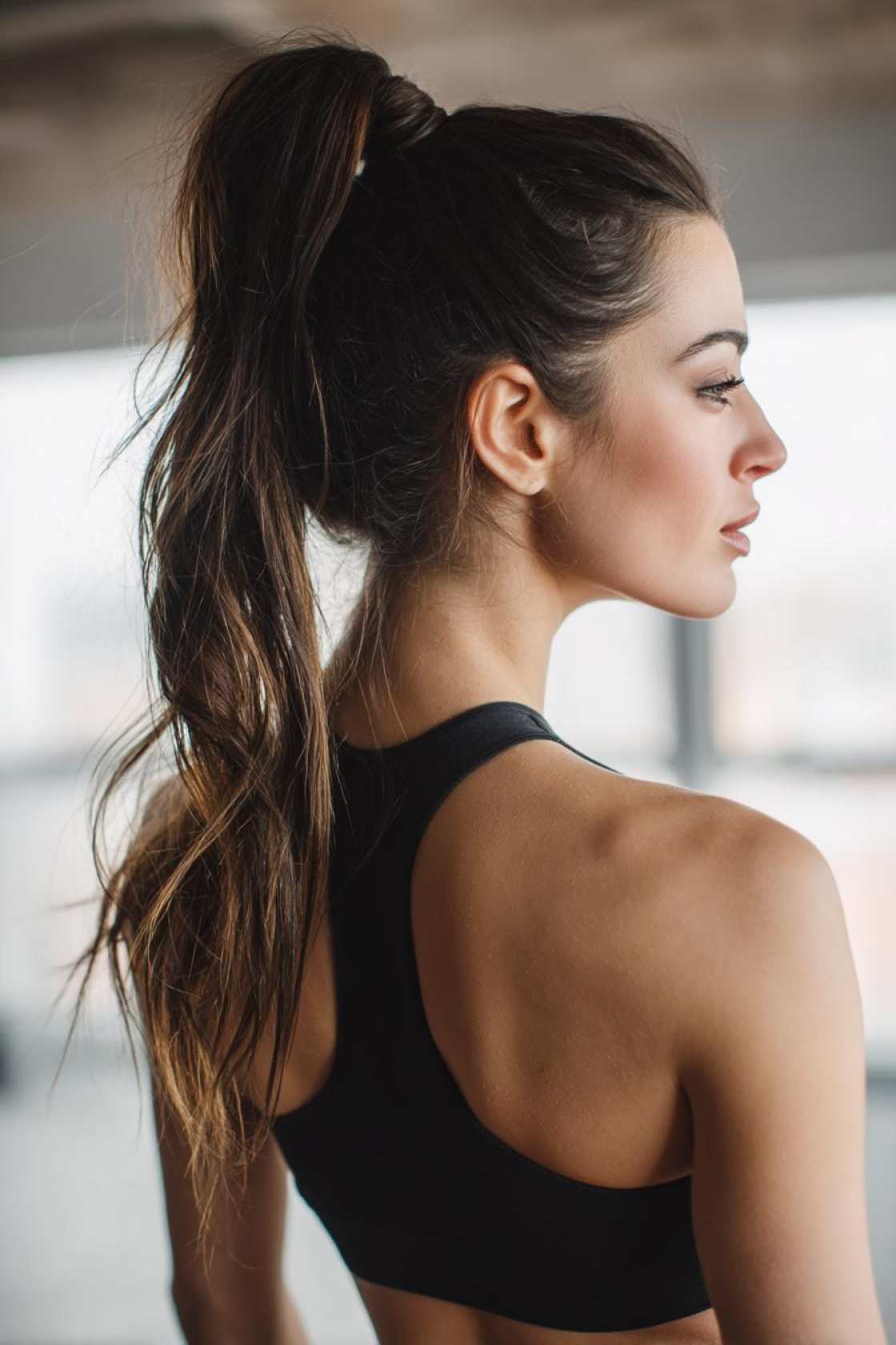 Lift, Lunge & Look Good: 20+ Stylish & Practical Hairstyles for the Gym. - 22. The Low Bun