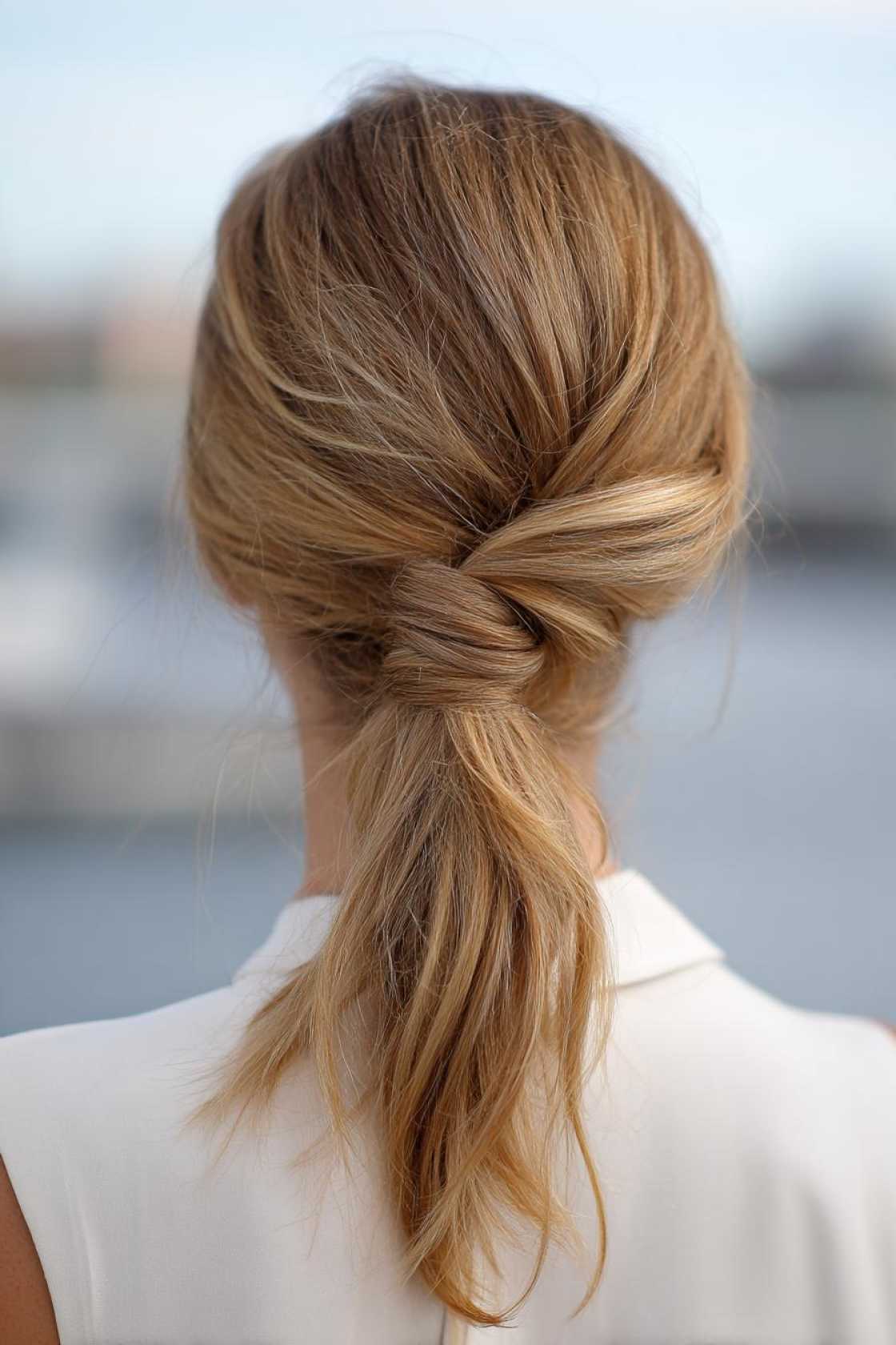 No-Fuss Fitness Hair: 18+ Easy Gym Hairstyles to Keep You Focused & Cool. - 15. Twisted Ponytail