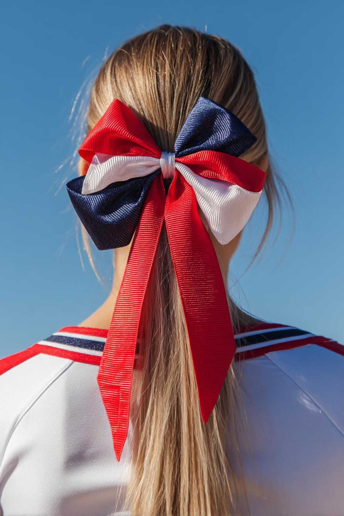 The Ultimate Cheer Pony Guide: 20+ Ways to Get Volume, Height & Hold. - 6. The Ponytail with Accessorized Base