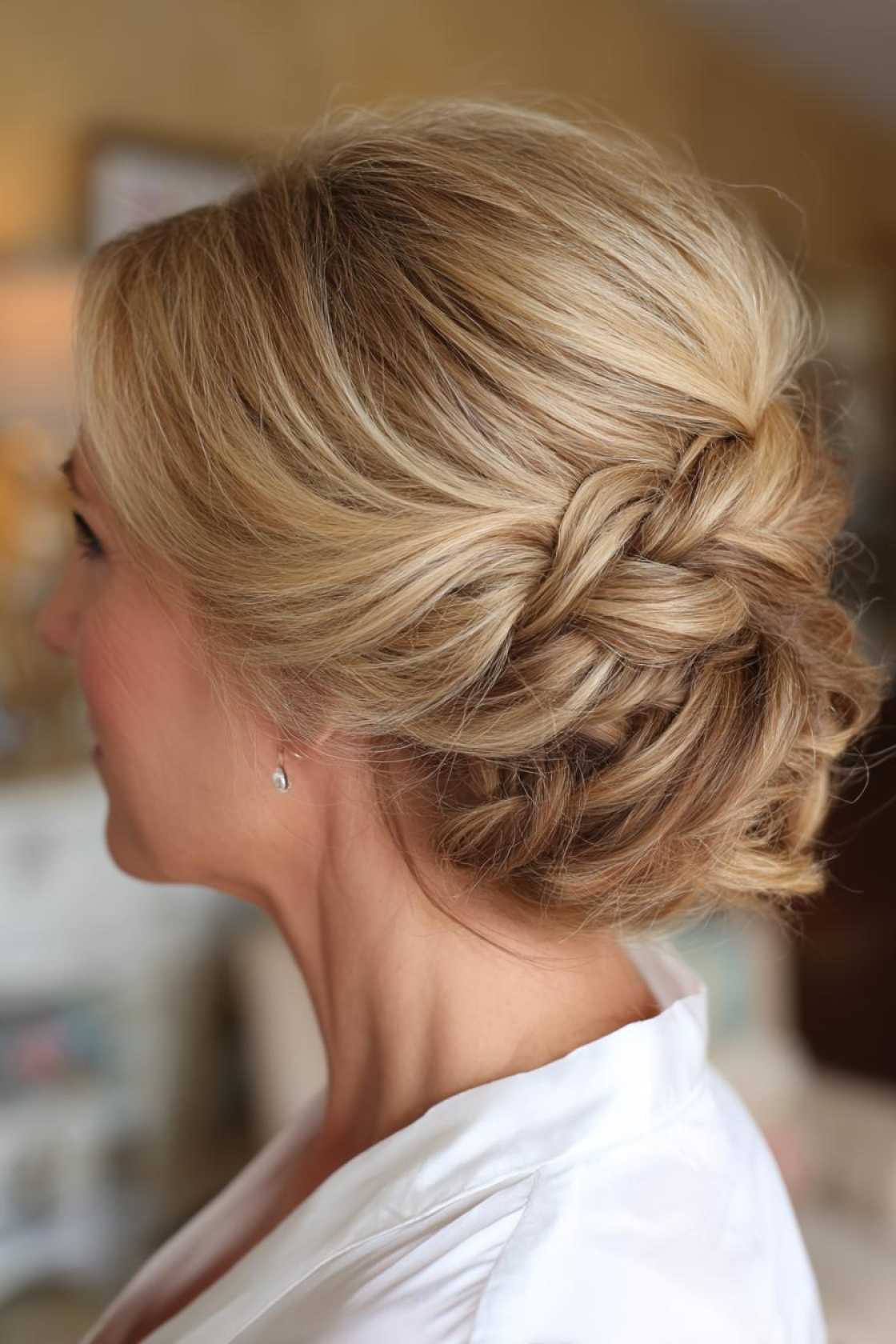 Timeless Beauty: 12+ Graceful Hairstyles for the Mother of the Groom. - 10. Low Bun with Braided Detail