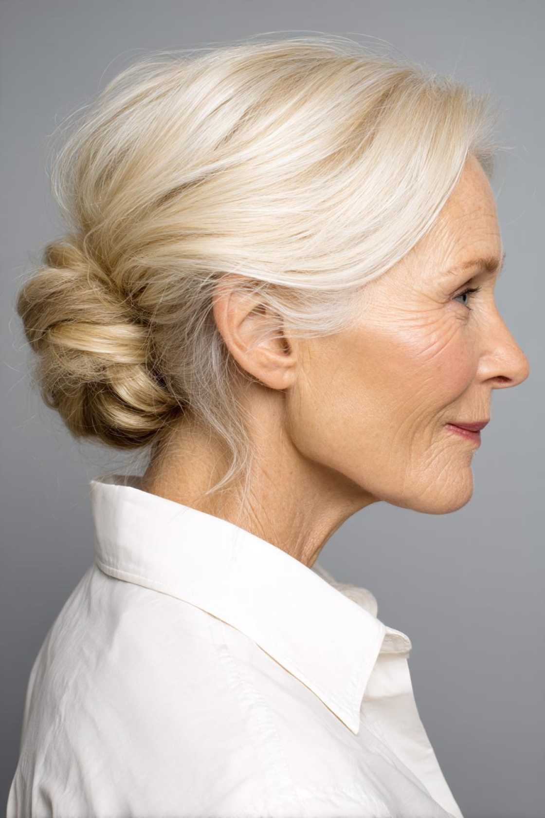 Wedding Day Glam: 20+ Stunning Hairstyle Inspirations for the Mother of the Groom. - 19. Low Bun with Face-Framing Pieces