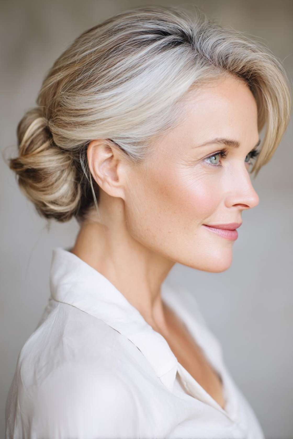 Age Beautifully, Celebrate Joyfully: 15+ Flattering Hairstyles for the Mother of the Groom. - 14. Low Bun with Face-Framing Pieces