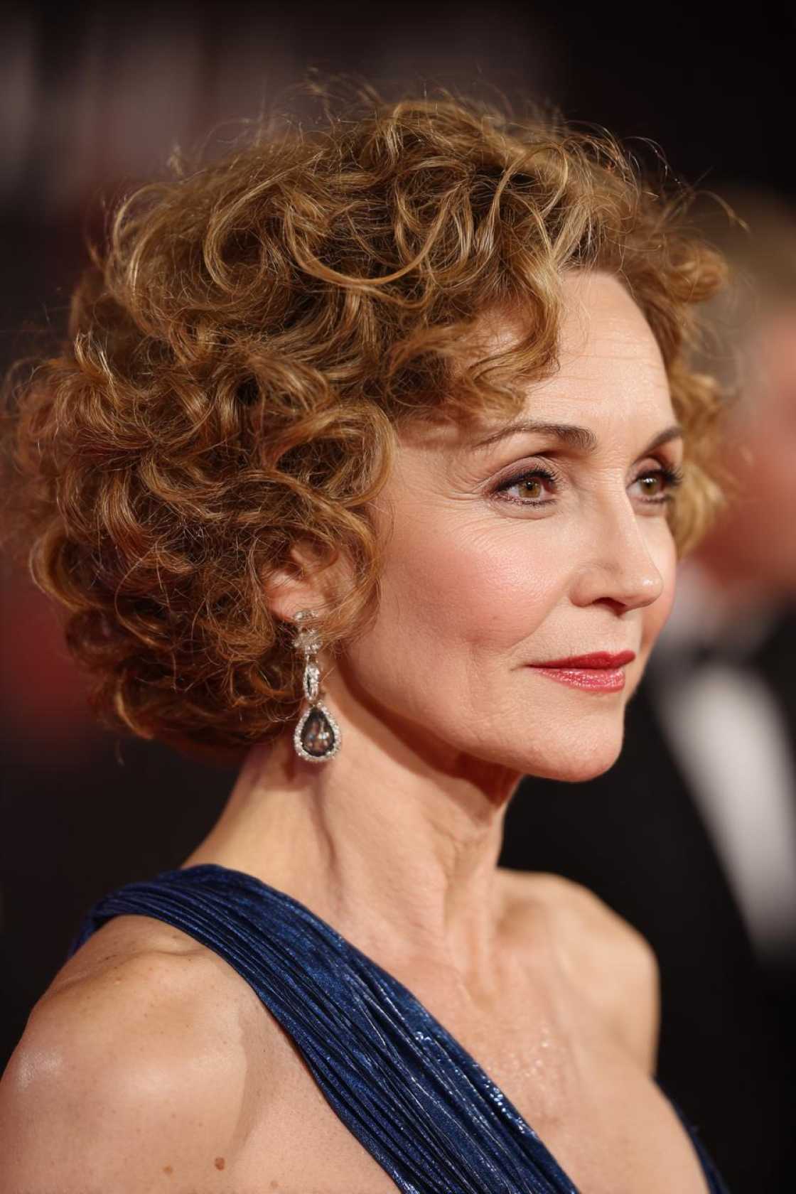 Age Beautifully, Celebrate Joyfully: 15+ Flattering Hairstyles for the Mother of the Groom. - 9. Side-Swept Curls