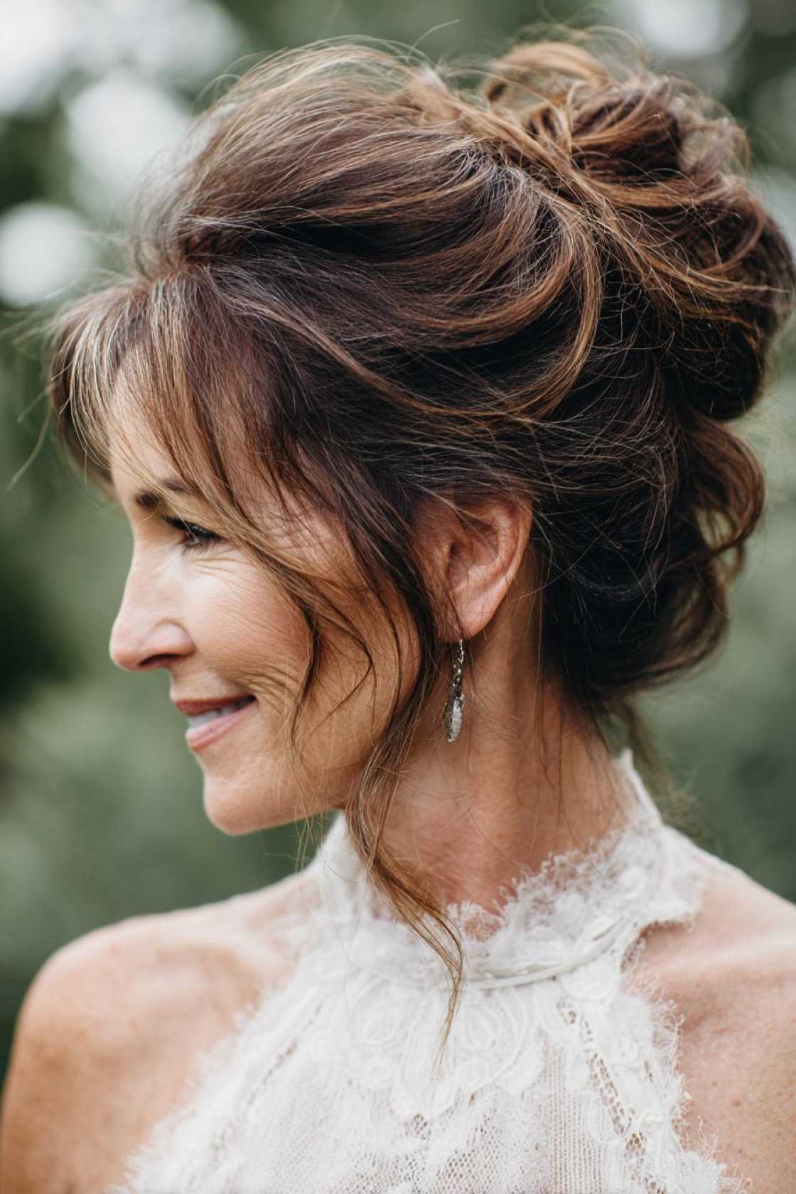 Age-Gracefully & Beautifully: 15+ Flattering Hairstyles for the Mother of the Bride. - 5. Messy Bun with Wisps