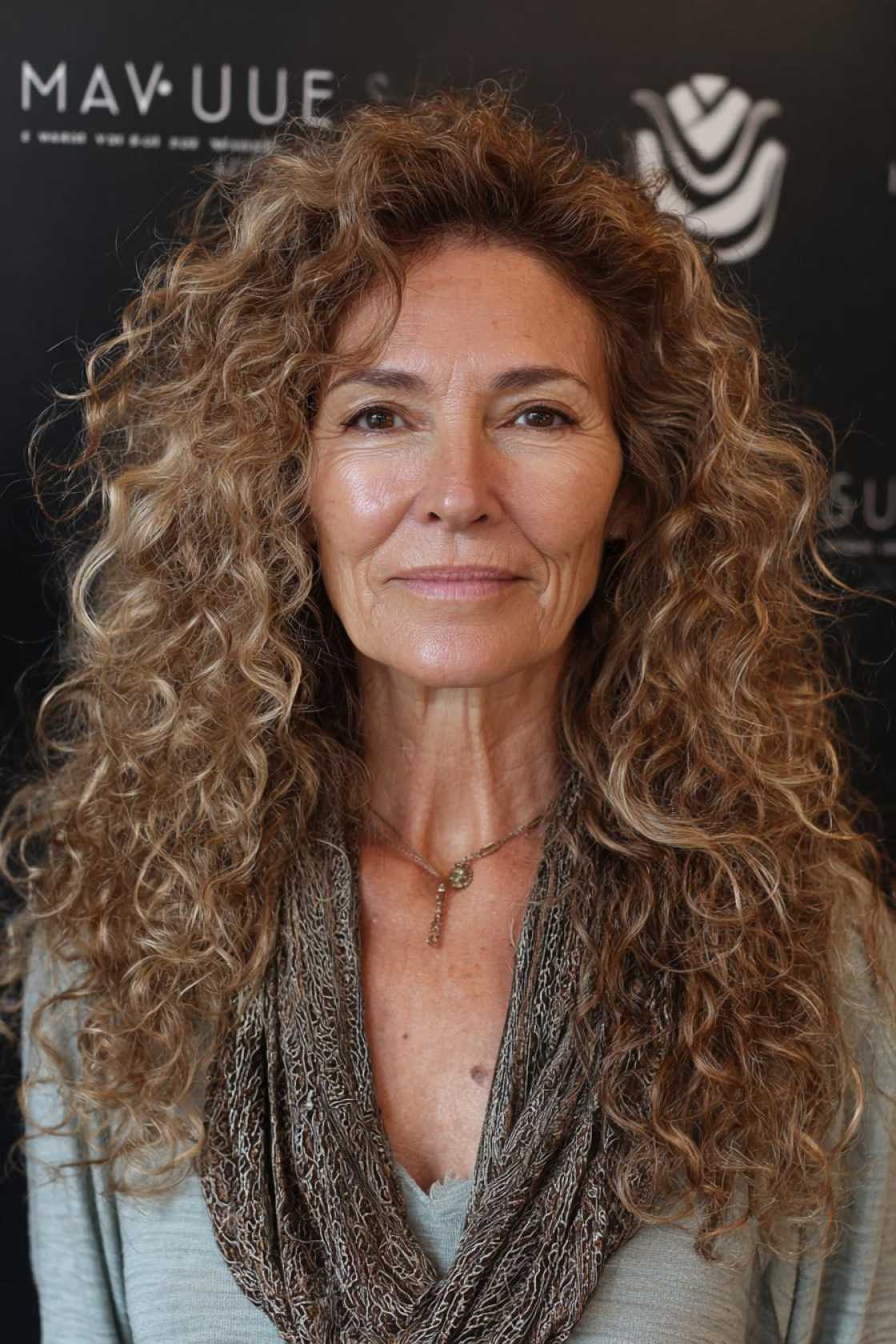 Ageless Curls: 20+ Chic & Modern Curly Hairstyle Ideas for Women Over 50. - 9. The Long, Layered Curls