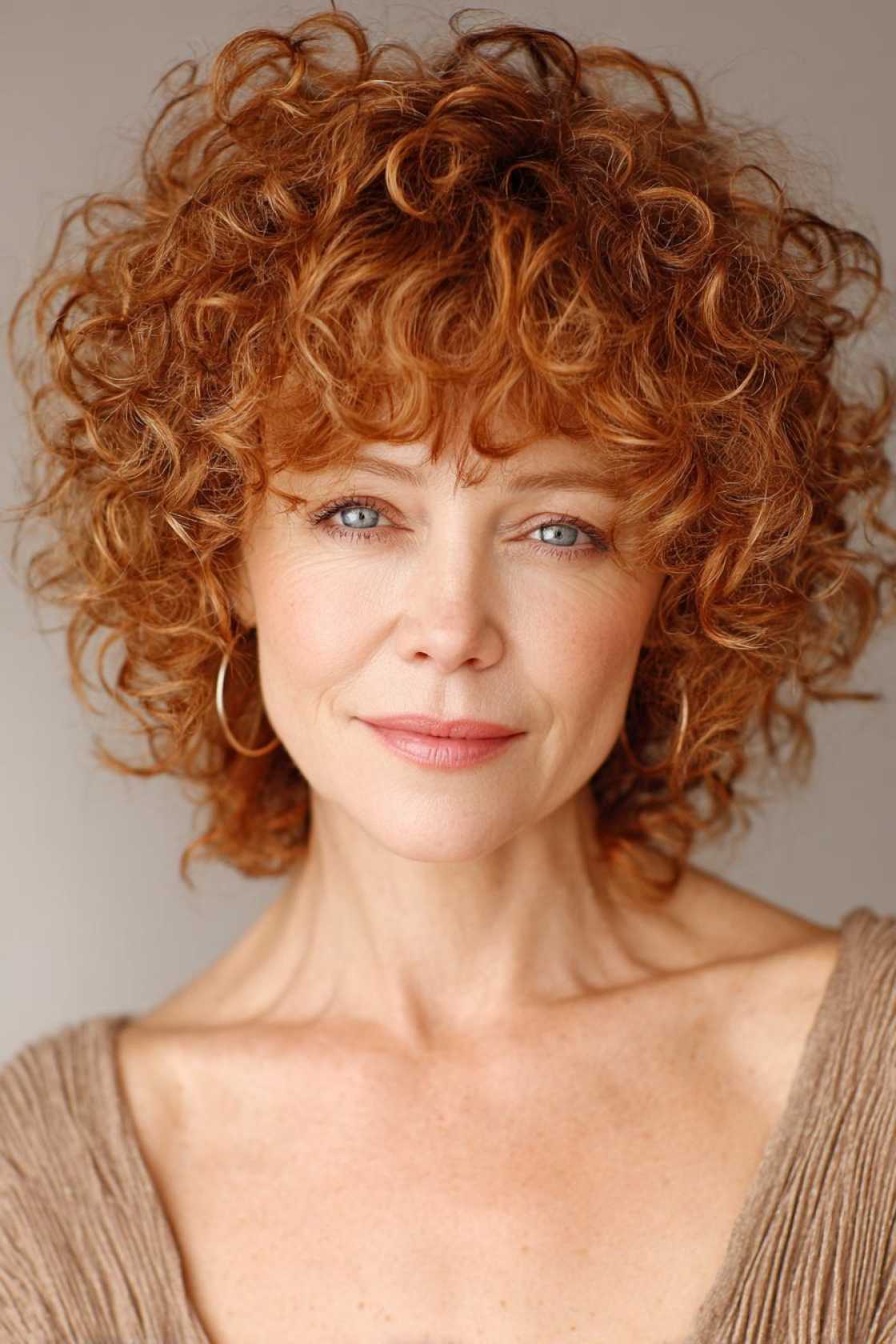 Ageless Curls: 20+ Chic & Modern Curly Hairstyle Ideas for Women Over 50. - 16. The Curly Fringe