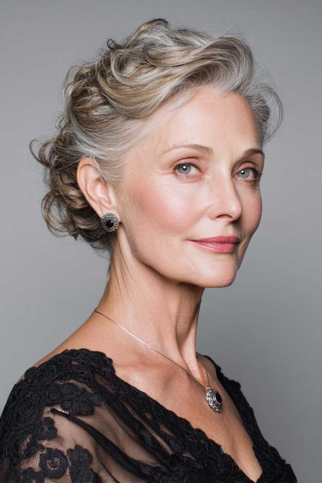 Ageless Curls: 20+ Chic & Modern Curly Hairstyle Ideas for Women Over 50. - 14. The Curly Updo with Face-Framing Ten