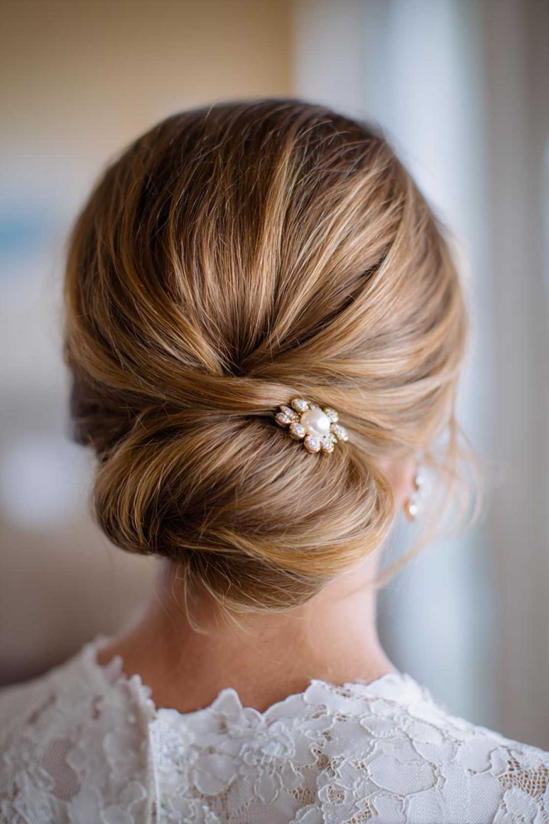 Classy Choices: 12+ Mother of the Groom Hairstyles (Updos, Bobs & Graceful Waves). - Sophisticated Chignon