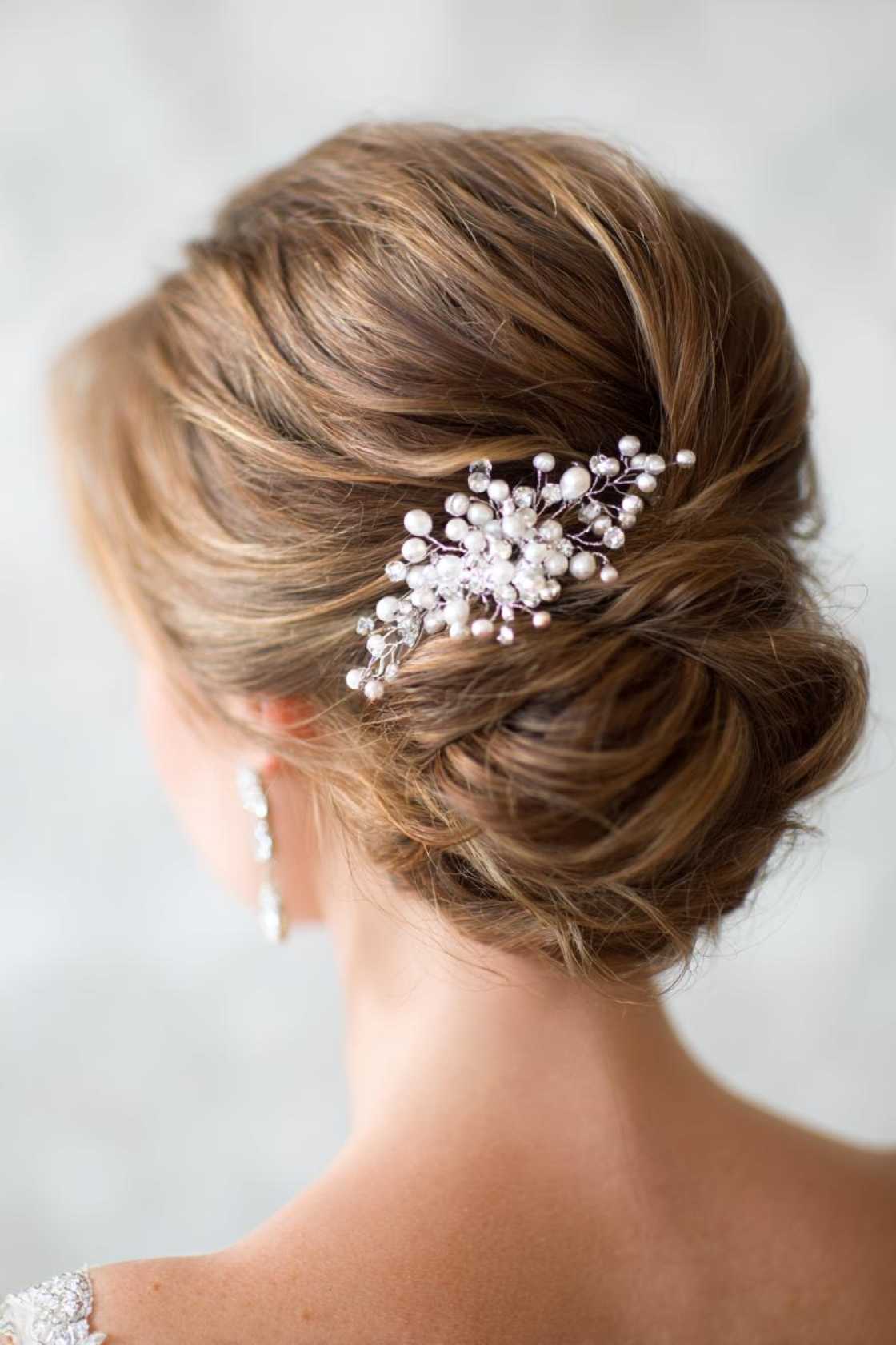 Classy Choices: 12+ Mother of the Groom Hairstyles (Updos, Bobs & Graceful Waves). - Elegant Updo with Embellishments
