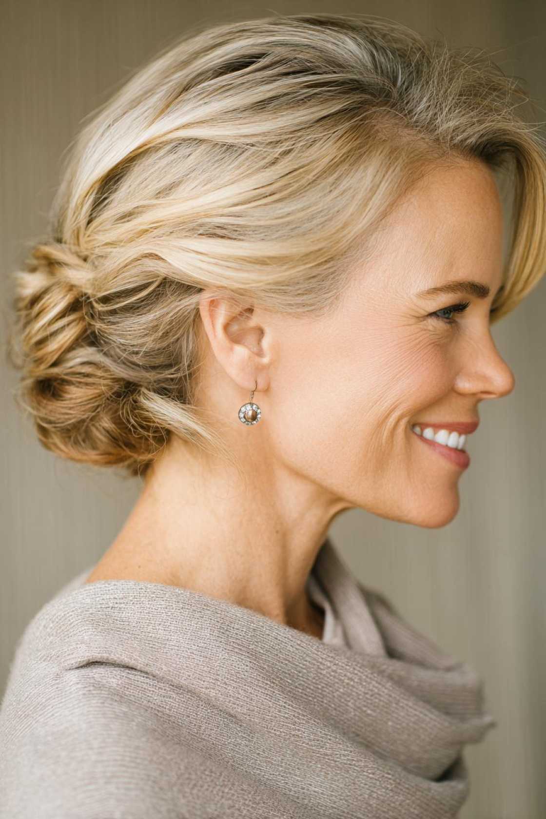 Classy Choices: 12+ Mother of the Groom Hairstyles (Updos, Bobs & Graceful Waves). - Low Bun with Face-Framing Pieces