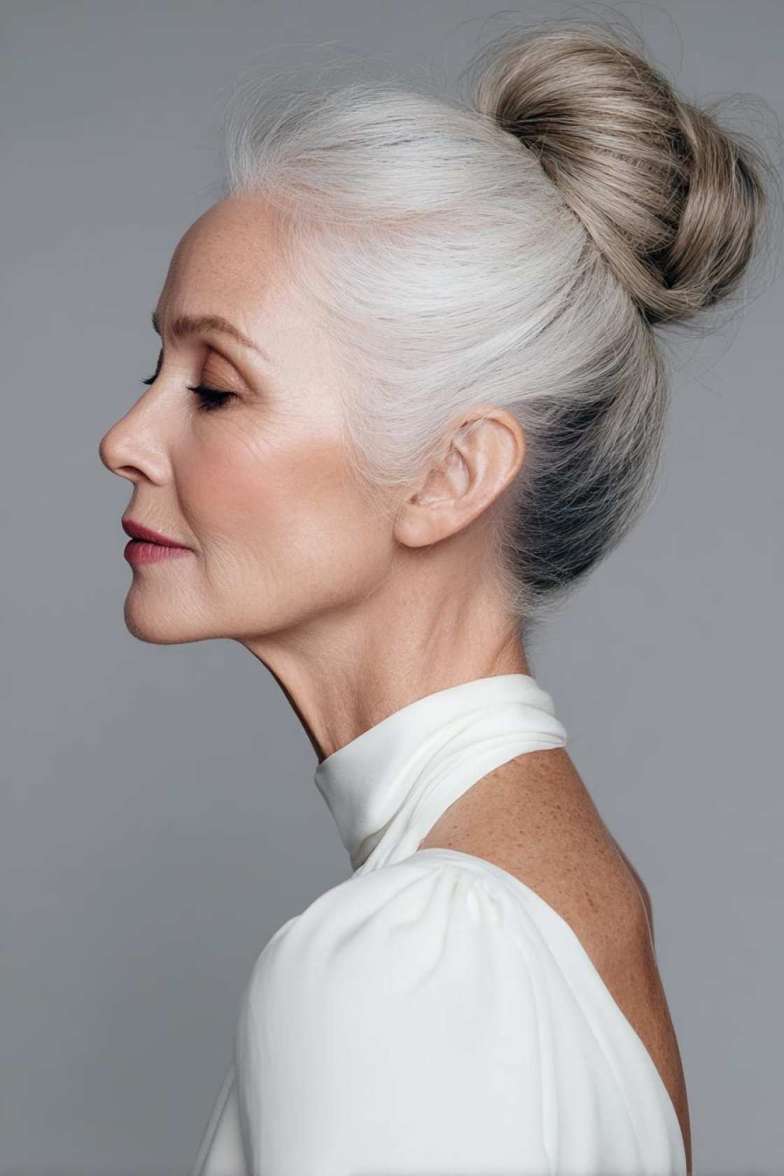 Classy Choices: 12+ Mother of the Groom Hairstyles (Updos, Bobs & Graceful Waves). - Sleek High Bun