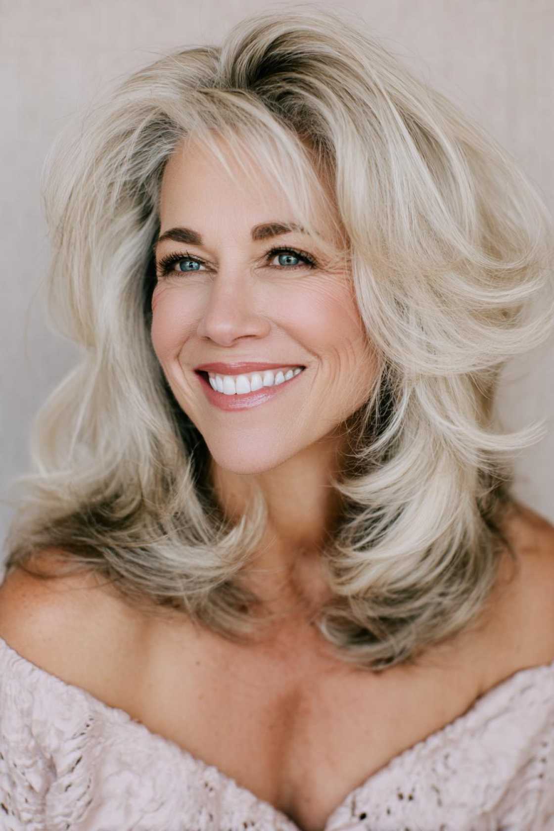 Classy Choices: 18+ Mother of the Groom Hairstyles (Updos, Bobs, Soft Waves). - 15. Voluminous Blowout