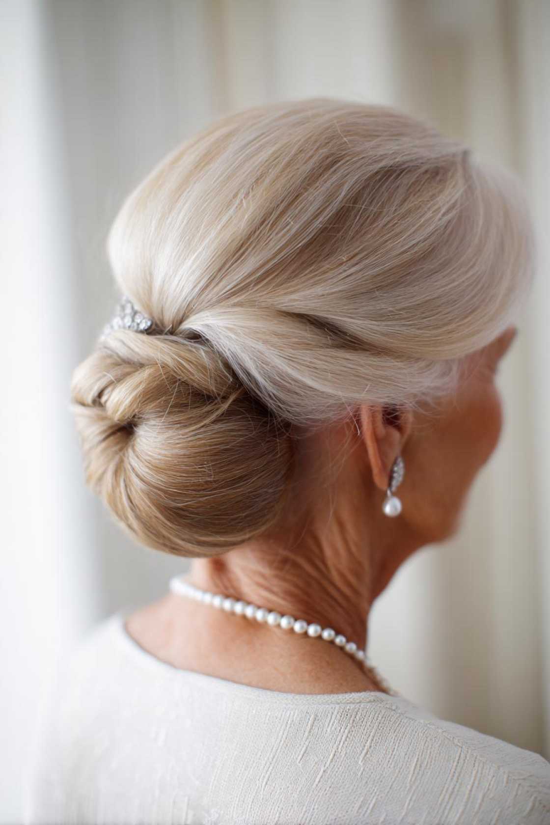 From Short Bobs to Elegant Updos: 15+ Flattering Hairstyles for the Mother of the Groom. - 16. Classic Chignon