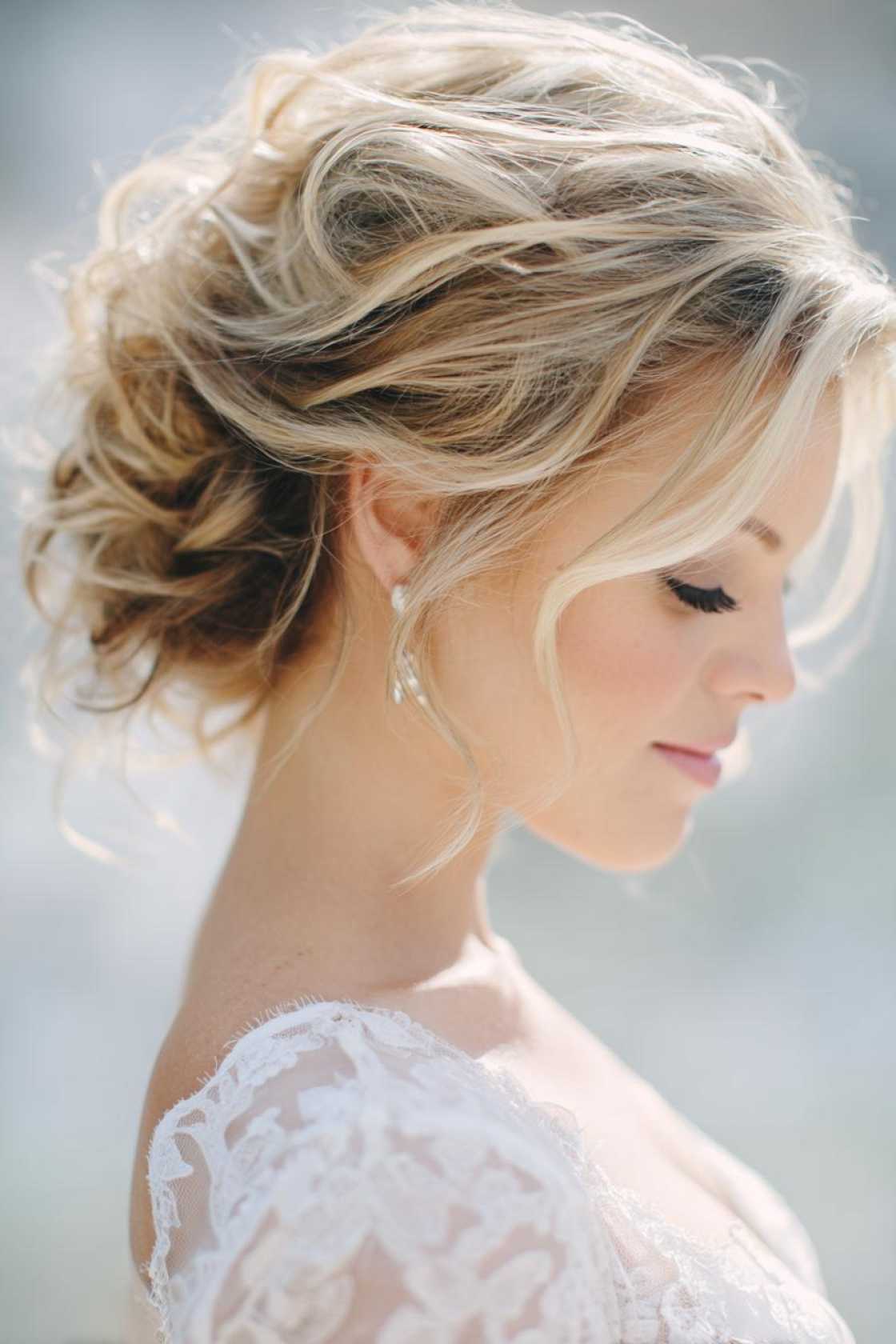 Sun-Kissed & Stunning: 15+ Summer Wedding Hairstyles for the Radiant Bride. - 1. Soft Updo with Loose Curls