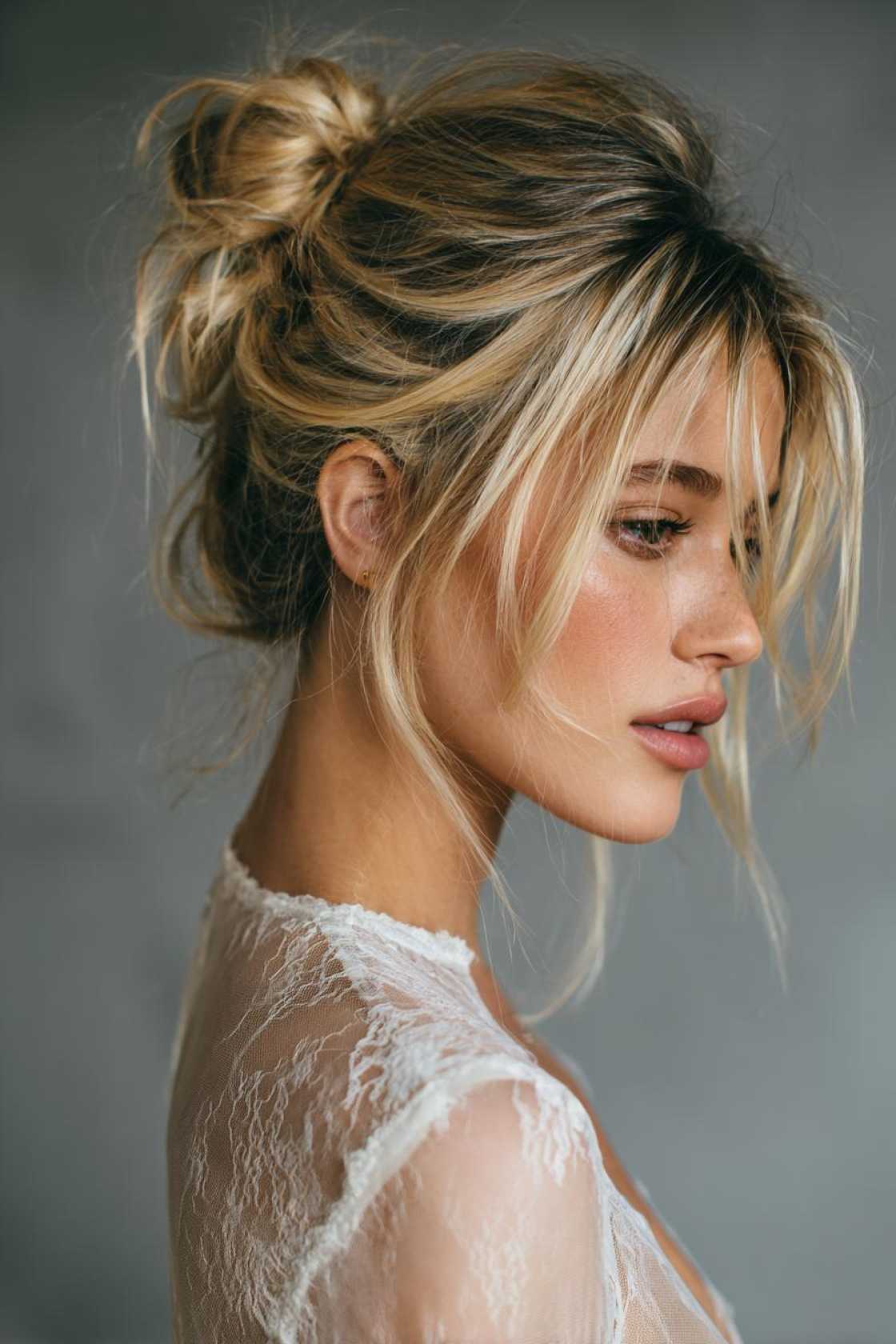 Sun-Kissed & Stunning: 15+ Summer Wedding Hairstyles for the Radiant Bride. - 11. Messy Bun with Face-Framing Tendrils