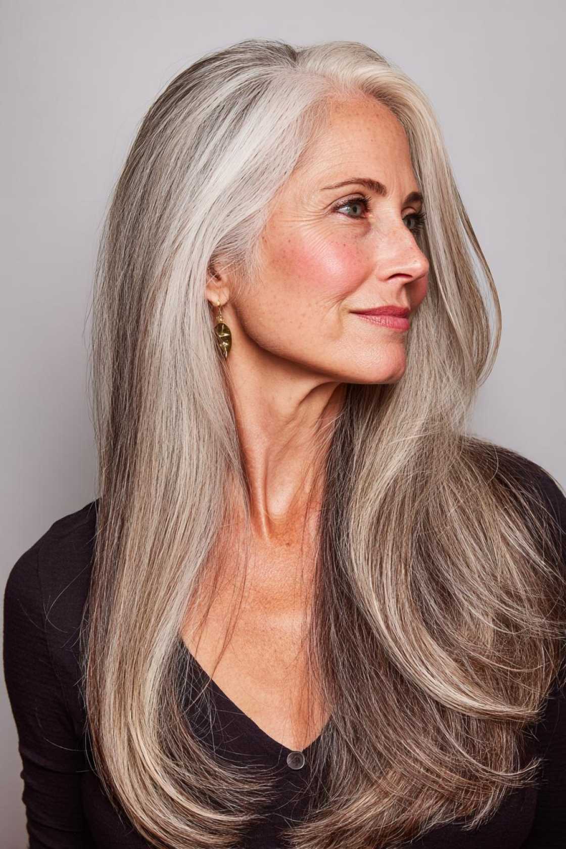 The 2025 Edit: 20+ Chic & Modern Long Haircuts for Women Over 50 (and Beyond!). - 10. The Deep Side Part