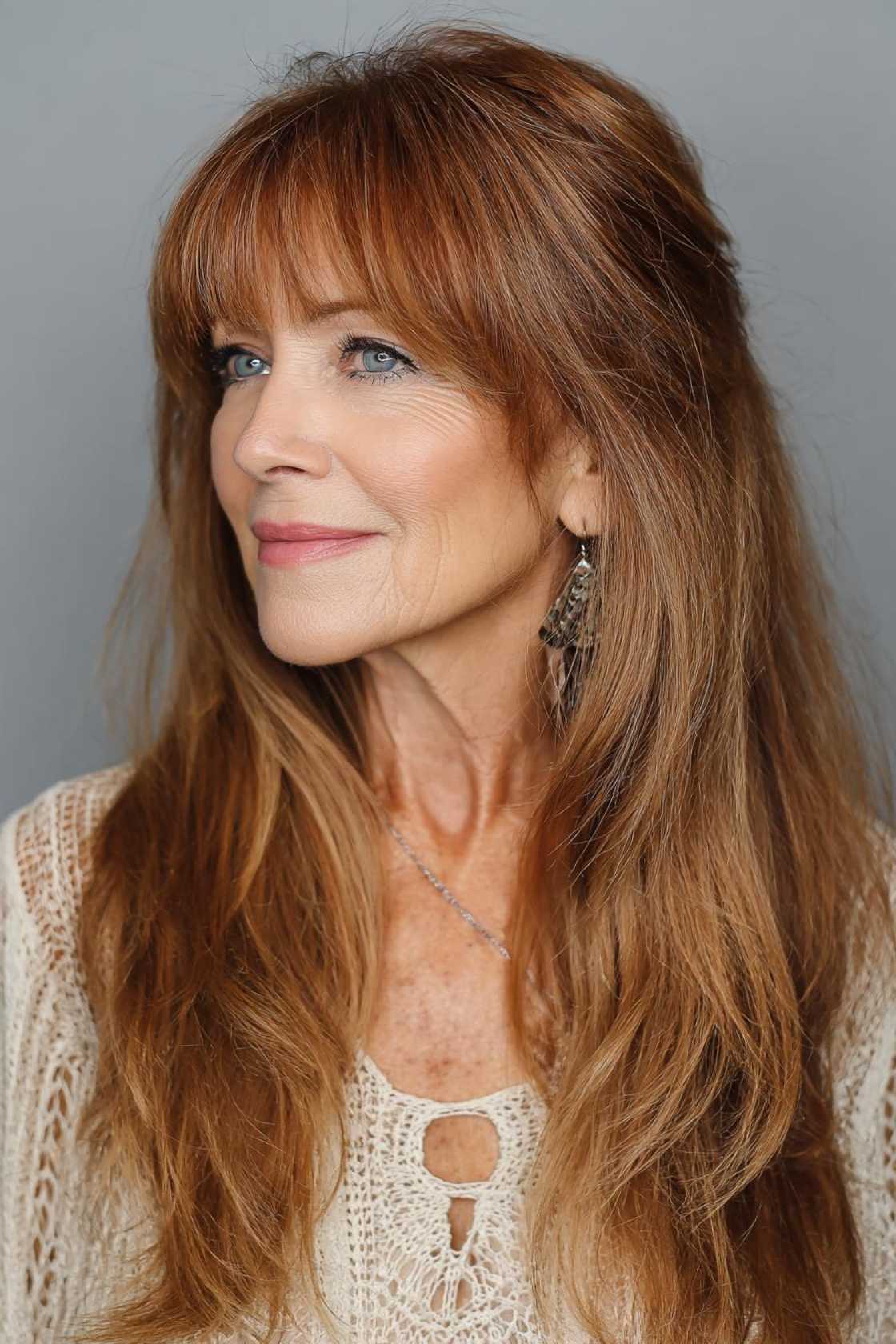 The 2025 Edit: 20+ Chic & Modern Long Haircuts for Women Over 50 (and Beyond!). - 13. The Long Hair with Bangs