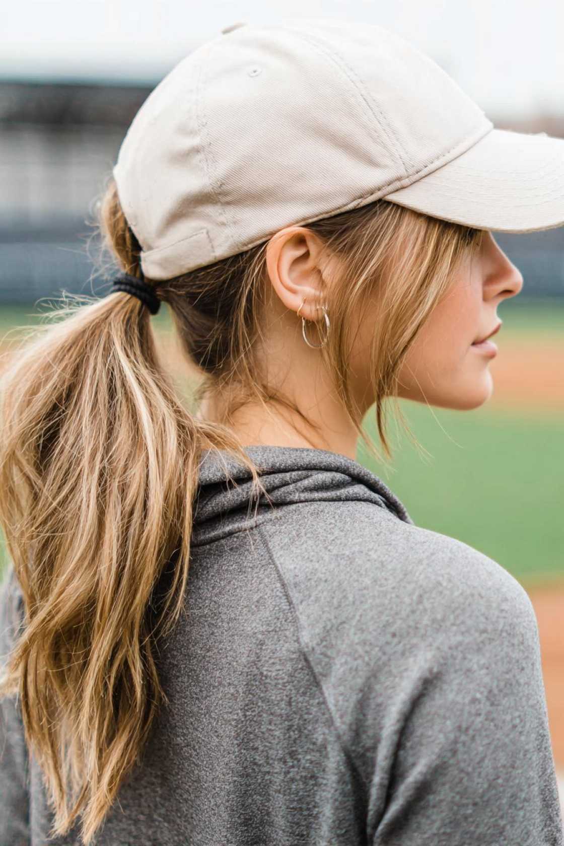 Your Go-To Guide for Game Day Glam: 12+ Baseball Hat Hairstyles That Always Win. - 13. The Low Ponytail