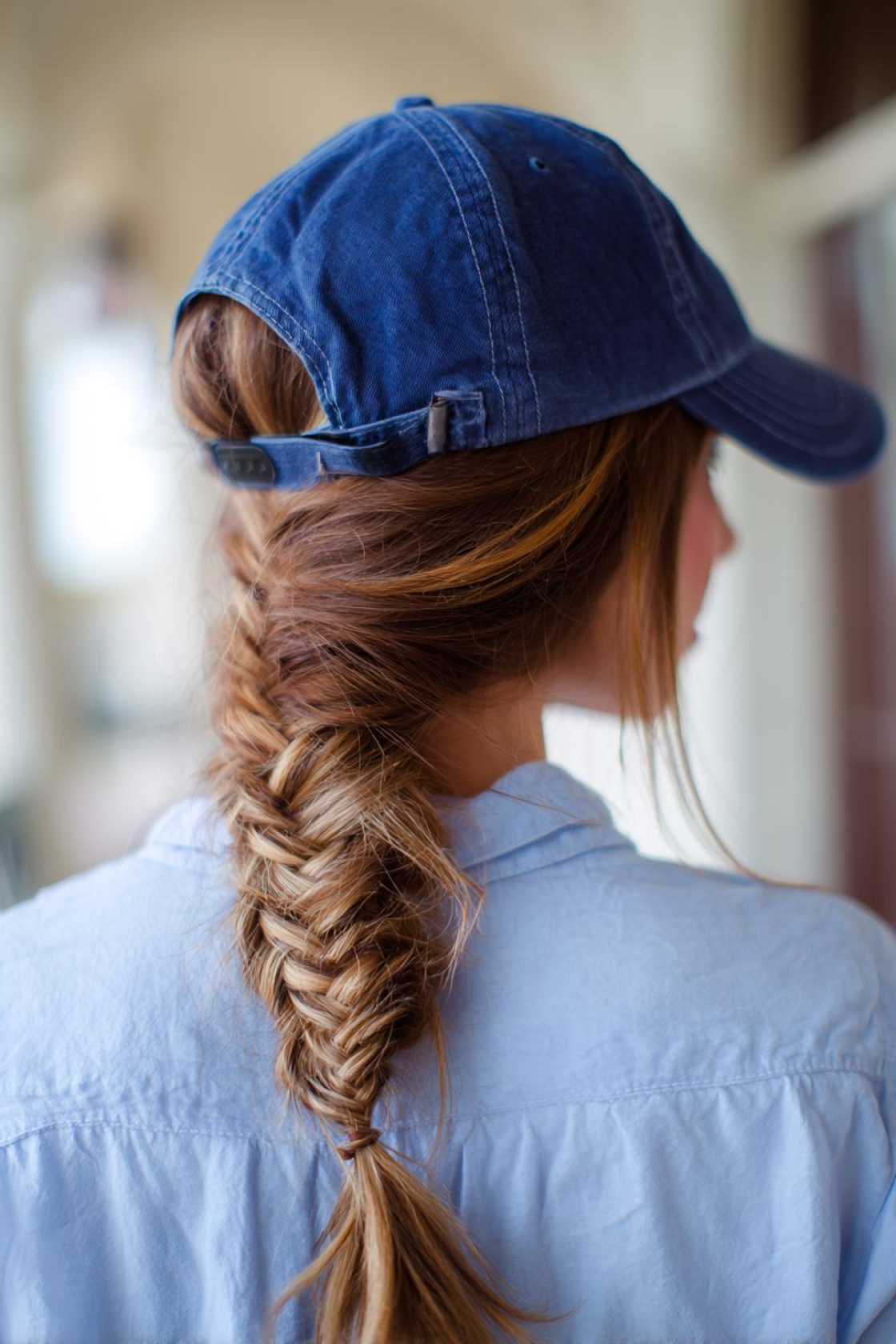 Your Go-To Guide for Game Day Glam: 12+ Baseball Hat Hairstyles That Always Win. - 9. Fishtail Braid