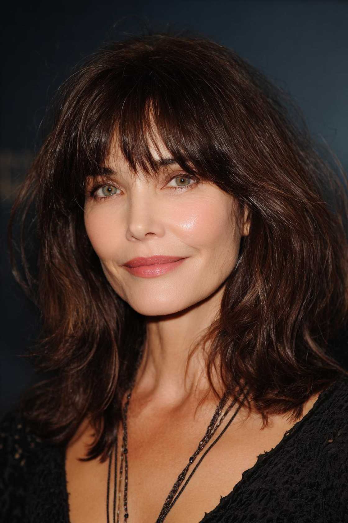 Fresh & Flattering: 12+ Hairstyles with Bangs That Suit Women Over 50 Beautifully - 11. Full and Textured Bangs