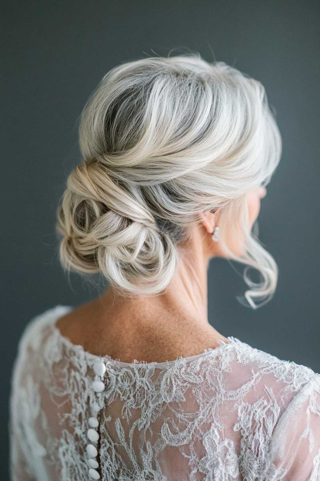 13+ Mother of the Bride Hairstyles That Feel Elegant Timeless and Modern - The Classic Updo with Face-Framing Piece